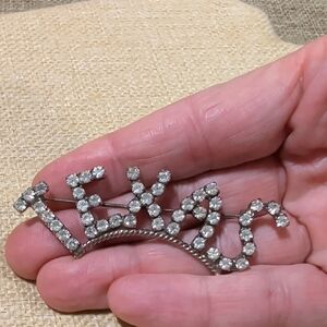 silver-tone metal "TEXAS" brooch pin with clear rhinestones
